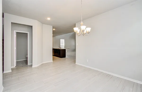 a view of a livingroom with a chandelier fan