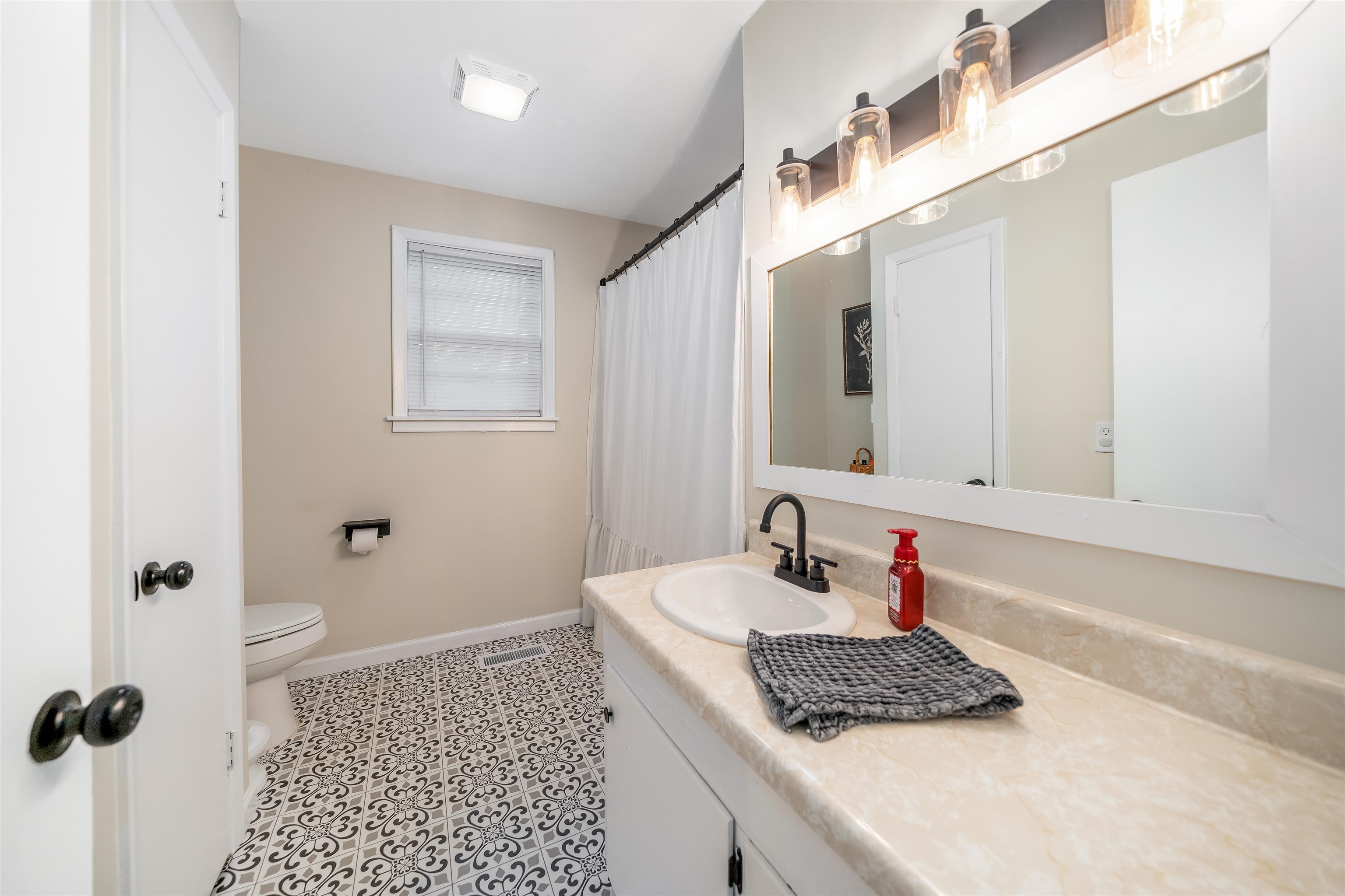 715 Burns Road Ramer, TN 38367 - Photo 18 of 20 Bathroom with vanity and a shower with shower curtain