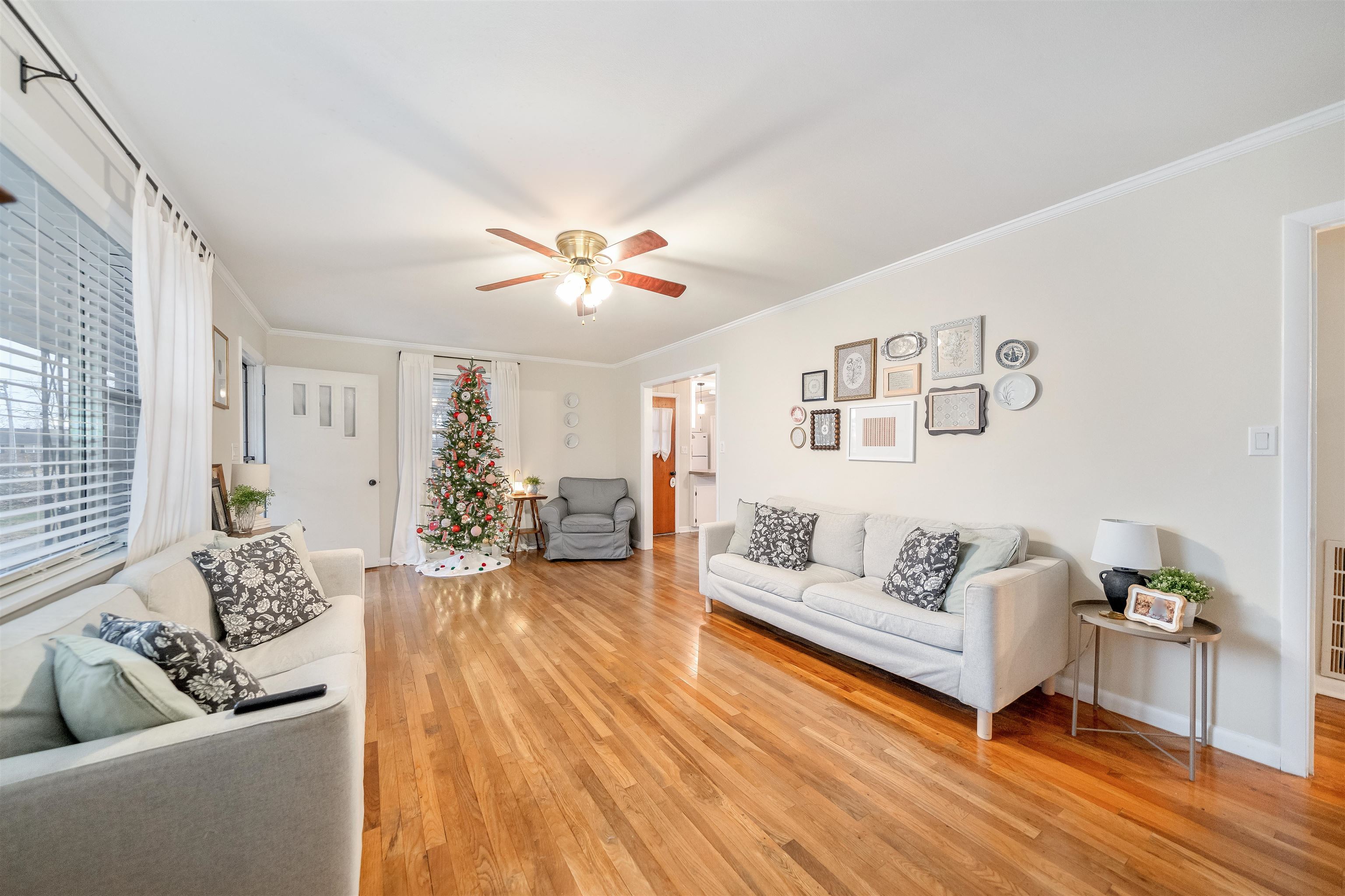 715 Burns Road Ramer, TN 38367 - Photo 6 of 20 Living area with light wood-style flooring, crown molding, and ceiling fan
