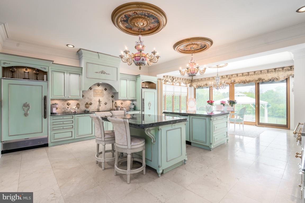 6779 Keller Lime Plant Road Frederick, MD 21703 - Photo 18 of 74 a kitchen with a table and chairs in it
