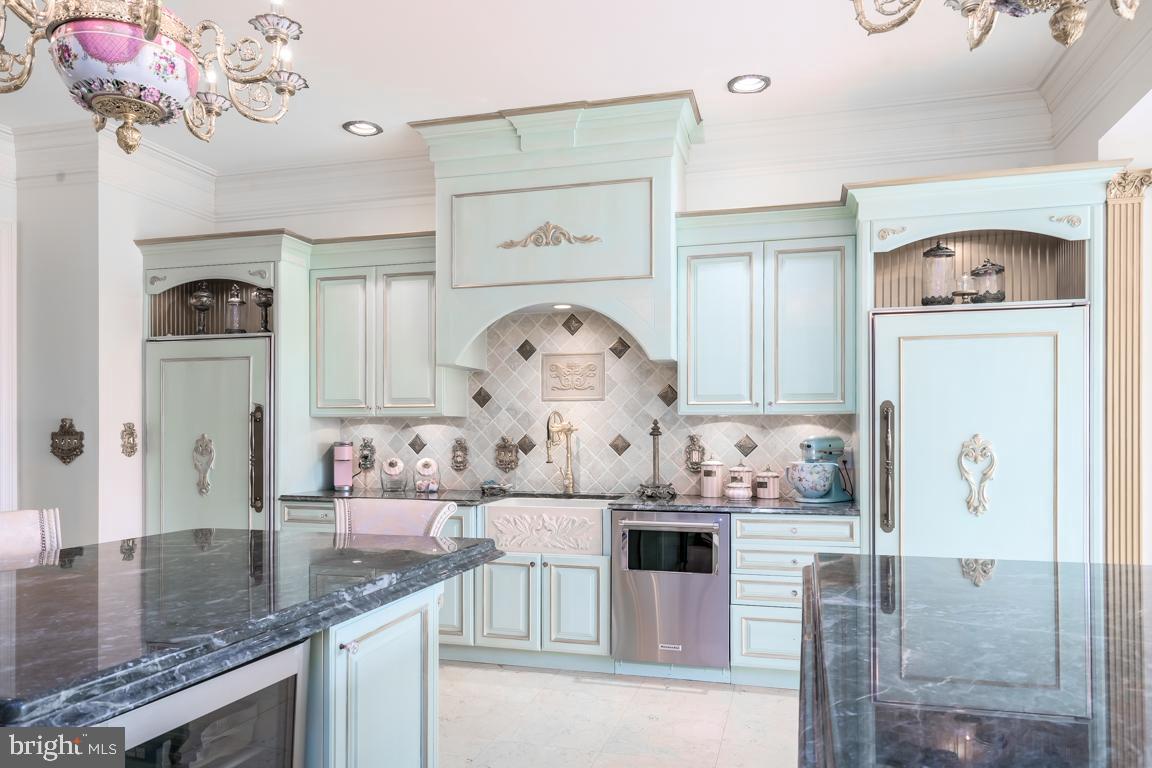 6779 Keller Lime Plant Road Frederick, MD 21703 - Photo 20 of 74 a kitchen with kitchen island a counter top space a stove and cabinets