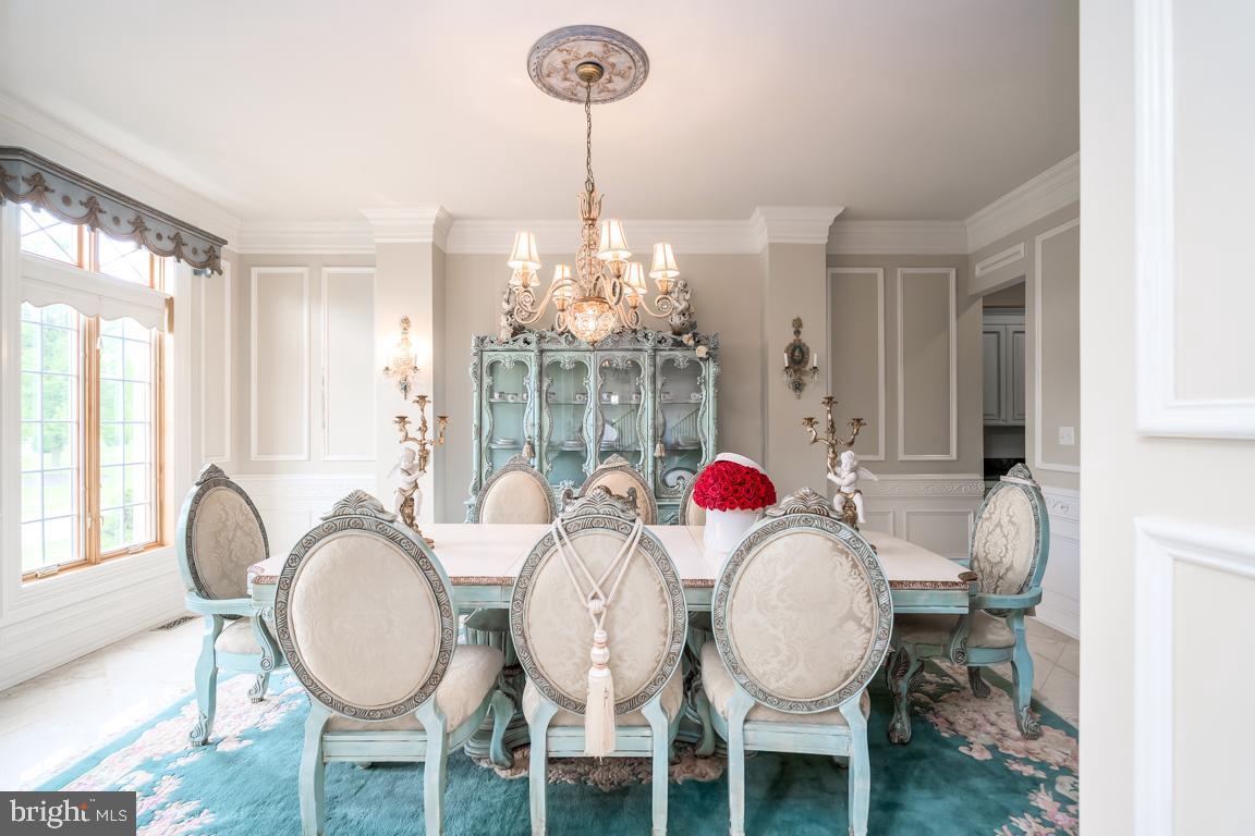 6779 Keller Lime Plant Road Frederick, MD 21703 - Photo 24 of 74 a view of a dining room with furniture wooden floor and chandelier