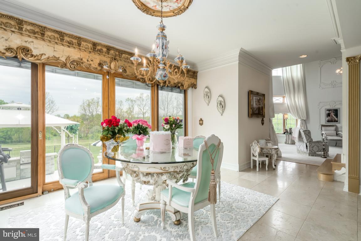 6779 Keller Lime Plant Road Frederick, MD 21703 - Photo 25 of 74 a view of a dining room with furniture and a chandelier