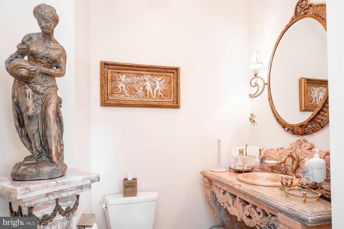 6779 Keller Lime Plant Road Frederick, MD 21703 - Photo 33 of 74 a bathroom with a sink a mirror and vanity