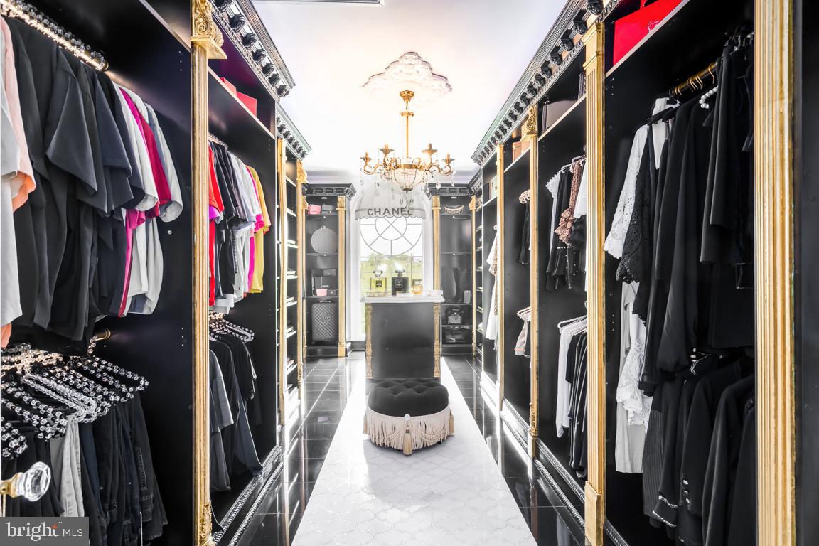 6779 Keller Lime Plant Road Frederick, MD 21703 - Photo 48 of 74 a view of walk in closet with clothes and shoes