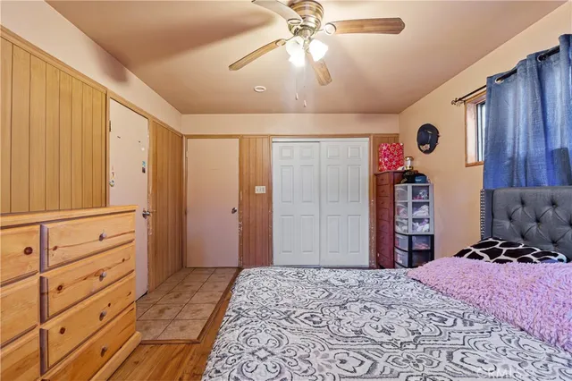 a bedroom with a bed and a dresser