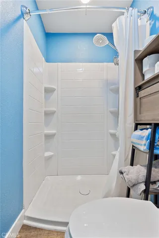 a white toilet sitting next to a bathroom sink
