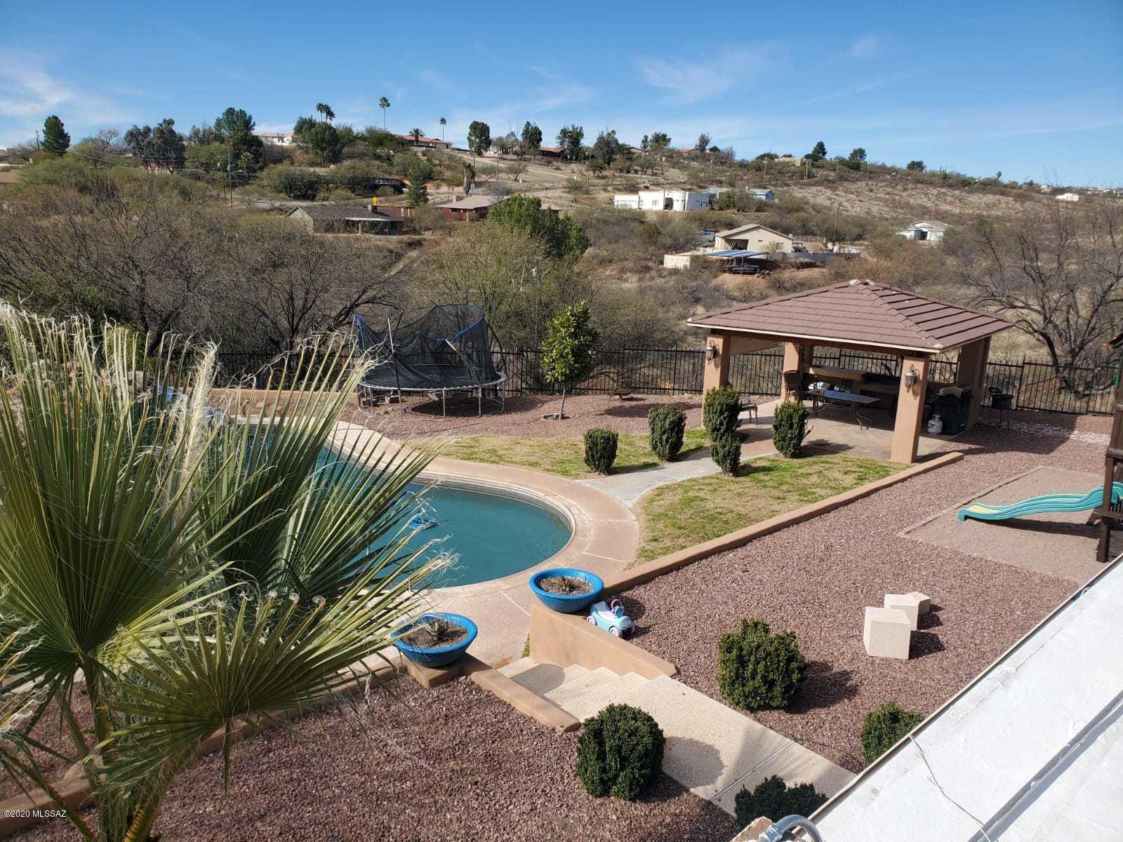 1186 Avenida Leon Rio Rico, AZ 85648 - Photo 9 of 31 an aerial view of a house with yard