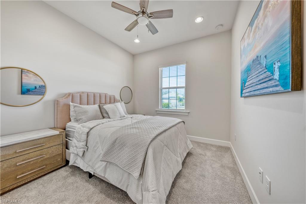 6421 Carnival Road Naples, FL 34113 - Photo 20 of 28 a bedroom with a bed and a window