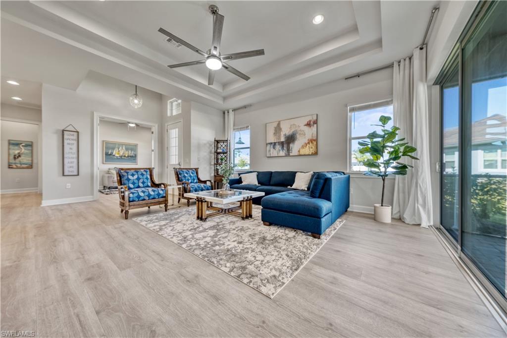 6421 Carnival Road Naples, FL 34113 - Photo 5 of 28 a living room with furniture and a large window