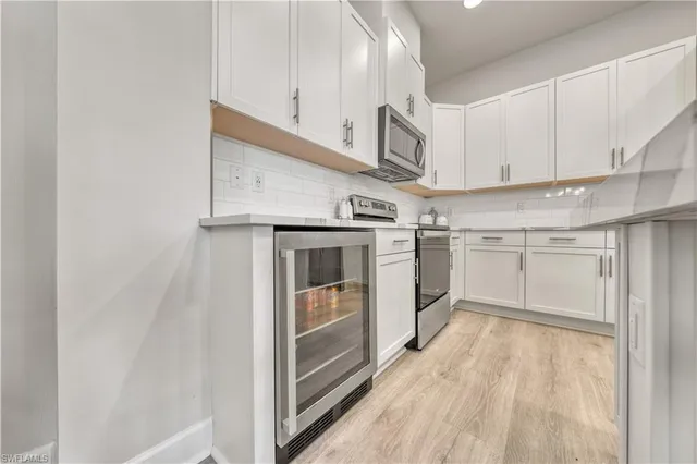 a view of a kitchen with electric appliances