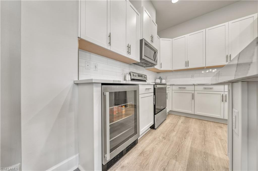 6421 Carnival Road Naples, FL 34113 - Photo 10 of 28 a view of a kitchen with electric appliances