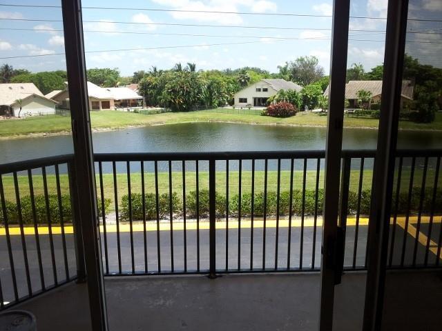 8761 Wiles Road, Unit 303 Coral Springs, FL 33067 - Photo 1 of 5 a view of lake from balcony