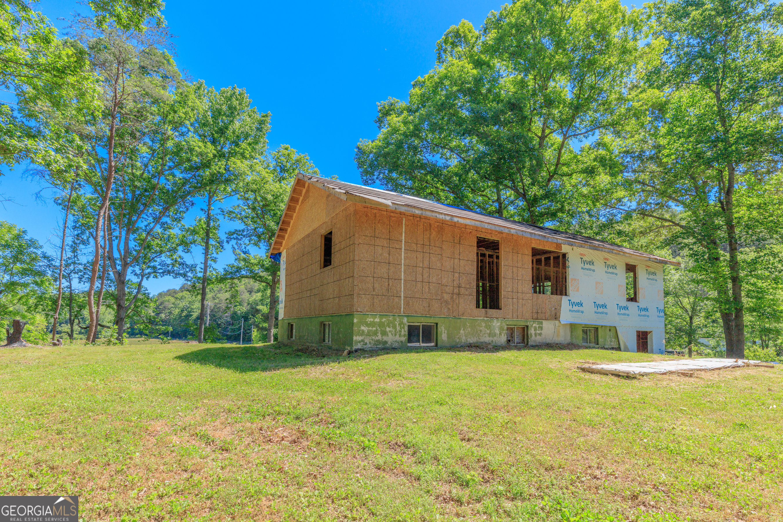 1004 Crow Gap Road Chickamauga, GA 30707 - Photo 10 of 36 a house view with swimming pool in front of it