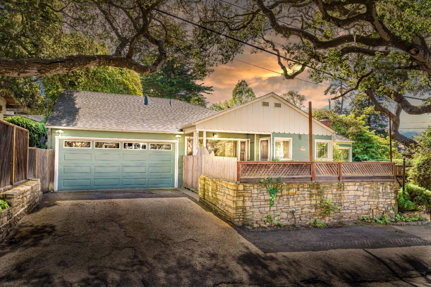 a view of a house with a yard and garage