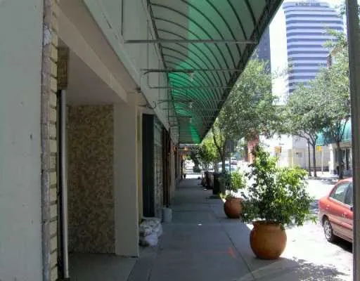 a view of a patio with furniture and potted plants