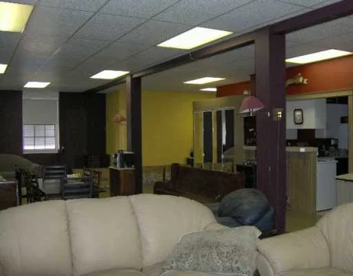 a large bedroom with a large bed and furniture