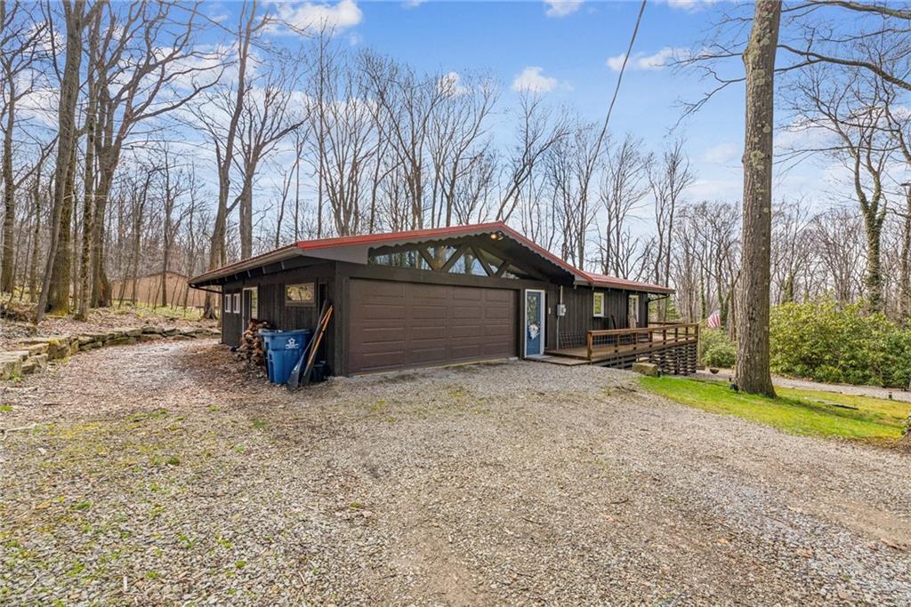 2095 Rocky Ridge Road Acme, PA 15610 - Photo 2 of 33 a view of backyard with a table and chairs under an umbrella