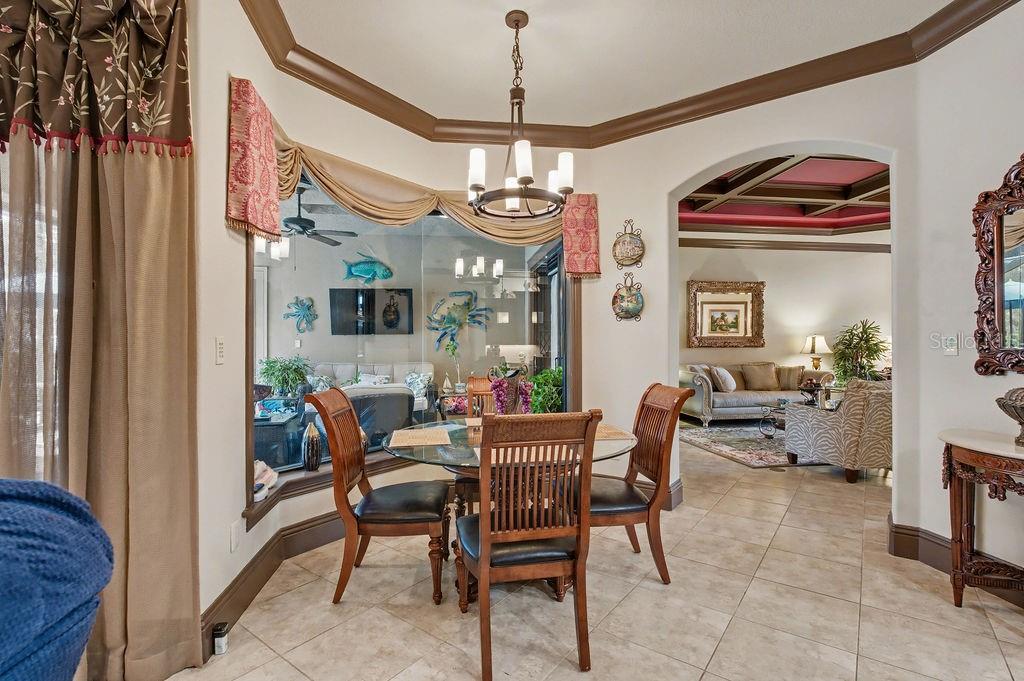 6662 Southwest 179th Ave Road Dunnellon, FL 34432 - Photo 13 of 51 a view of a dining room with furniture window and wooden floor