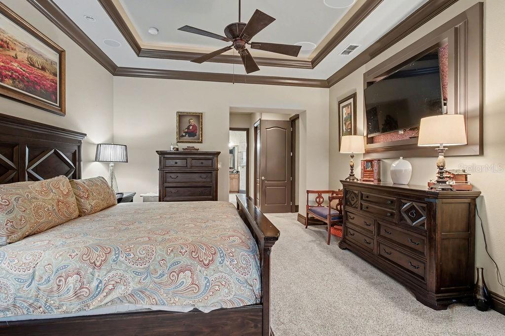 6662 Southwest 179th Ave Road Dunnellon, FL 34432 - Photo 17 of 51 a bedroom with a bed and a flat tv screen on dresser