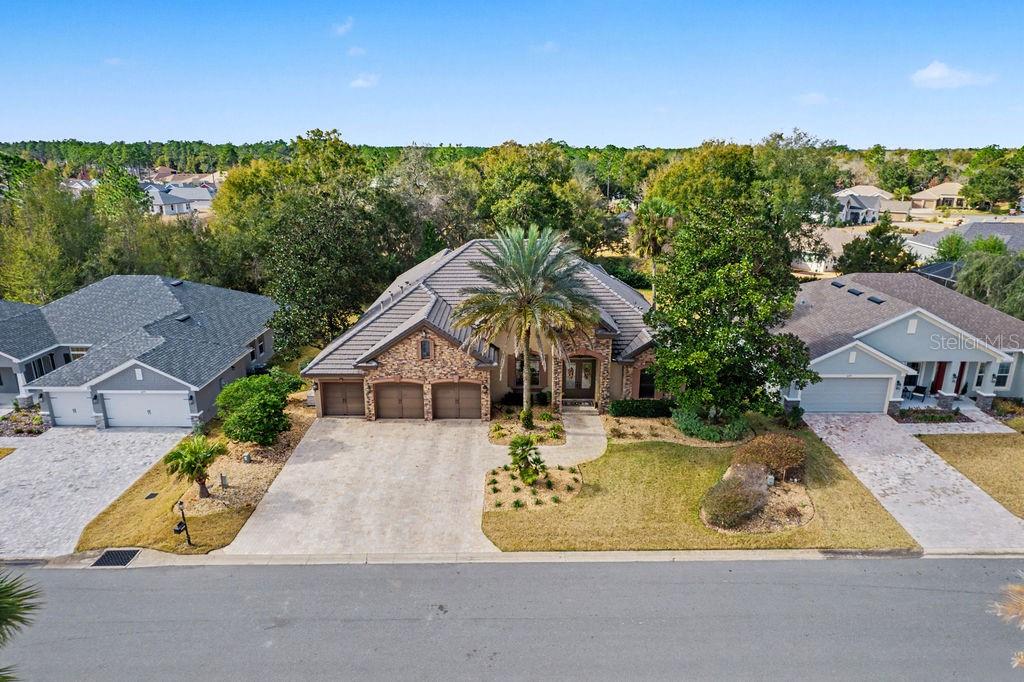 6662 Southwest 179th Ave Road Dunnellon, FL 34432 - Photo 2 of 51 an aerial view of a house with a swimming pool outdoor seating and yard