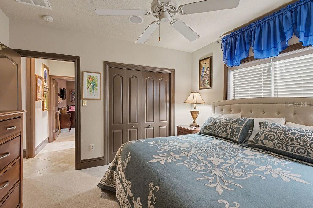 6662 Southwest 179th Ave Road Dunnellon, FL 34432 - Photo 21 of 51 a bedroom with a bed and a chandelier