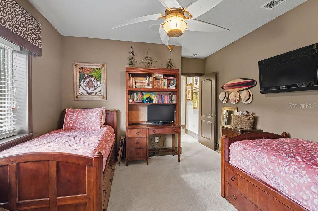 6662 Southwest 179th Ave Road Dunnellon, FL 34432 - Photo 23 of 51 a bedroom with a bed and flat screen tv