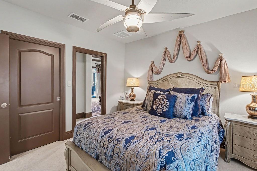 6662 Southwest 179th Ave Road Dunnellon, FL 34432 - Photo 25 of 51 a bedroom with a bed and a chandelier