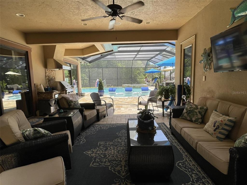 6662 Southwest 179th Ave Road Dunnellon, FL 34432 - Photo 34 of 51 a living room with furniture and a large window