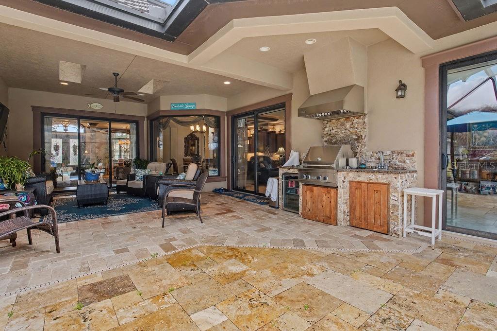 6662 Southwest 179th Ave Road Dunnellon, FL 34432 - Photo 35 of 51 a living room with stainless steel appliances kitchen island granite countertop furniture and a livingroom view