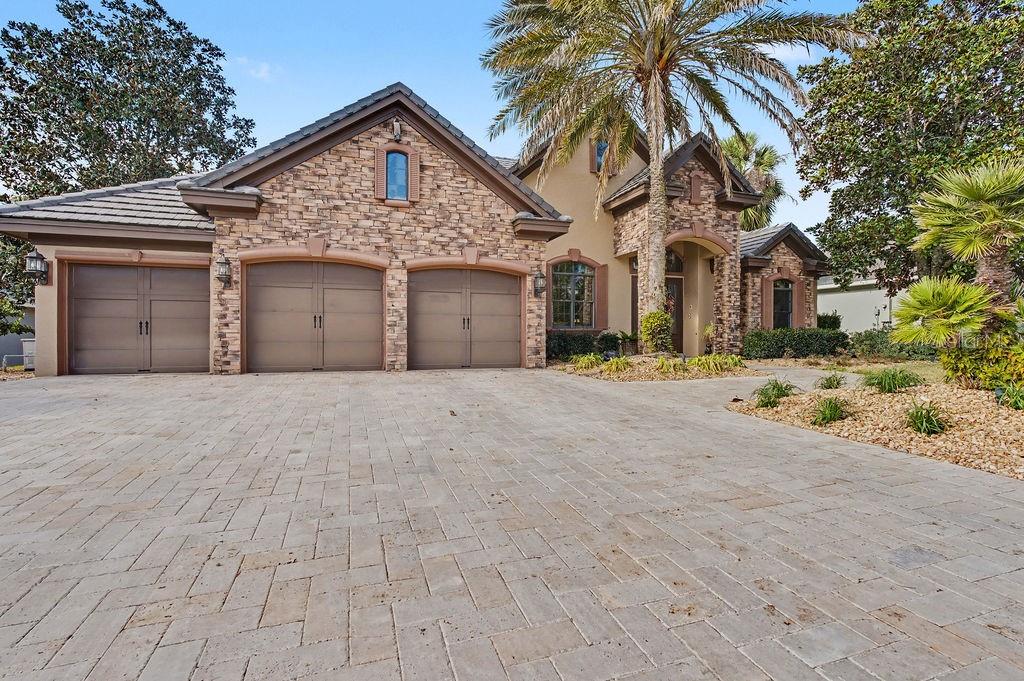 6662 Southwest 179th Ave Road Dunnellon, FL 34432 - Photo 48 of 51 a front view of a house with a yard and garage