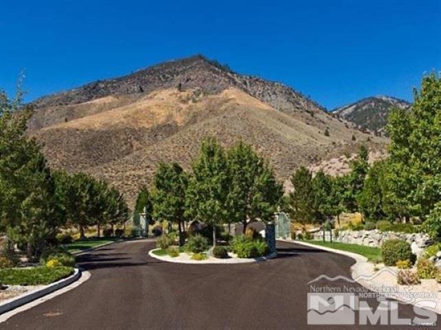 a view of a wooden house with a yard