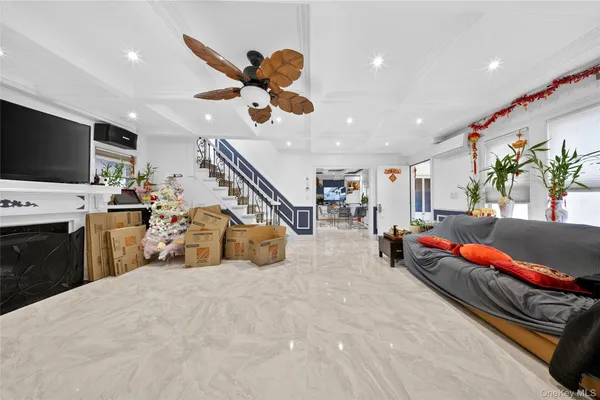 a living room with furniture gym equipment and a large window