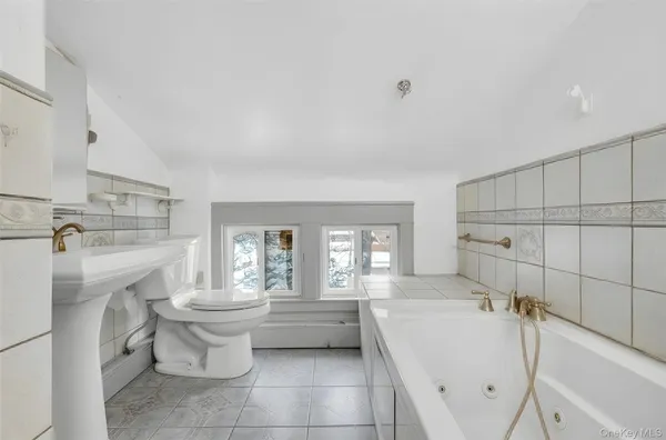 a bed room with a bed and a television