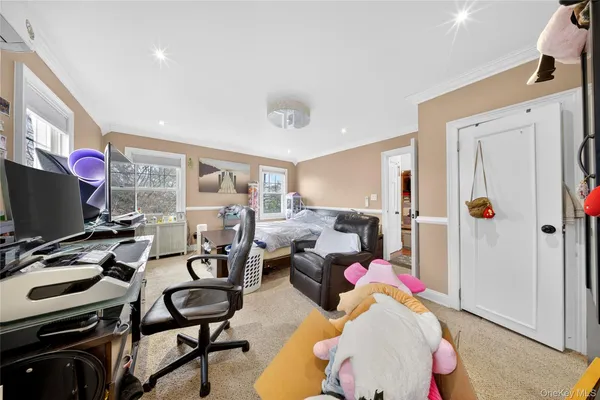 an aerial view of a house with a garden and lake view