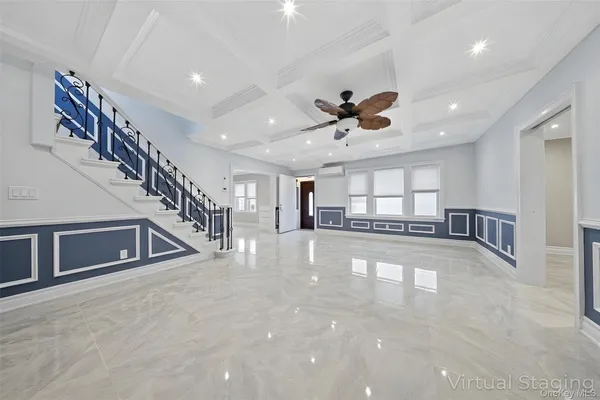 a kitchen with stainless steel appliances kitchen island granite countertop a table chairs sink and cabinets