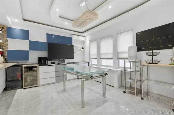 a kitchen with stainless steel appliances kitchen island granite countertop a stove and a sink
