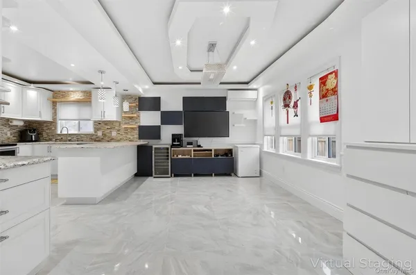 a kitchen with granite countertop cabinets stainless steel appliances and a sink