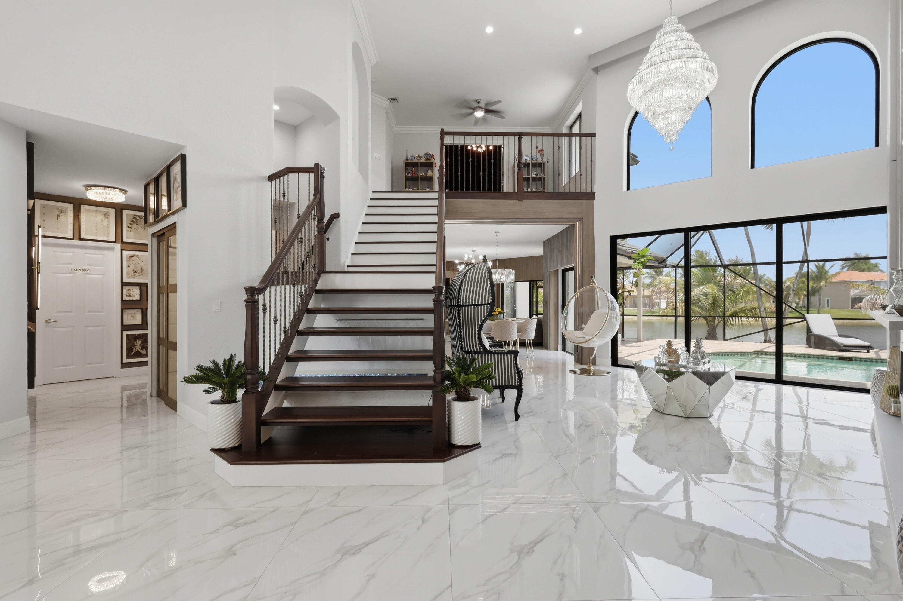 22257 Vista Lago Drive Boca Raton, FL 33428 - Photo 13 of 82 a view of entryway and hall with wooden floor