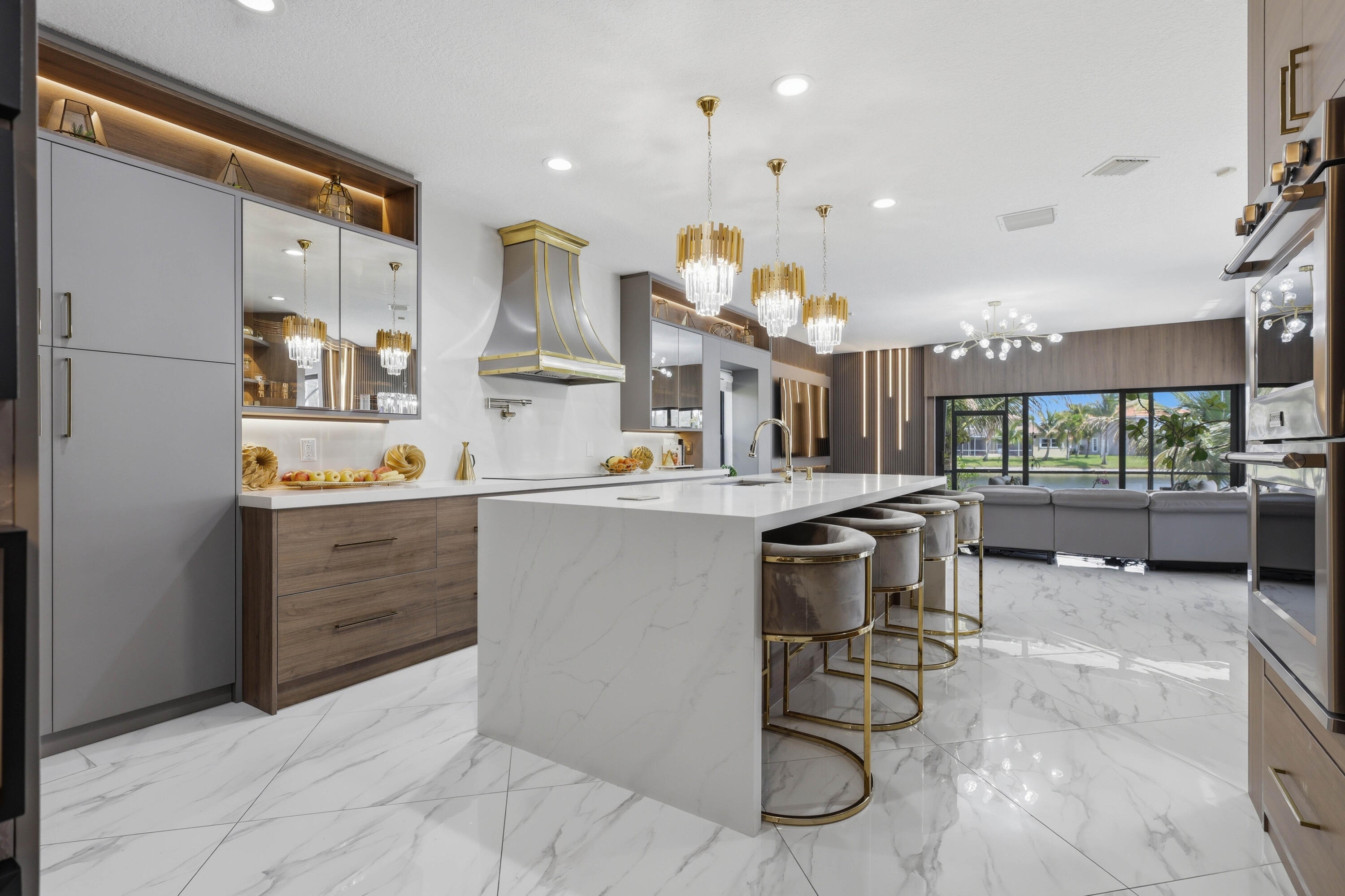 22257 Vista Lago Drive Boca Raton, FL 33428 - Photo 24 of 82 a kitchen with a sink stainless steel appliances and cabinets