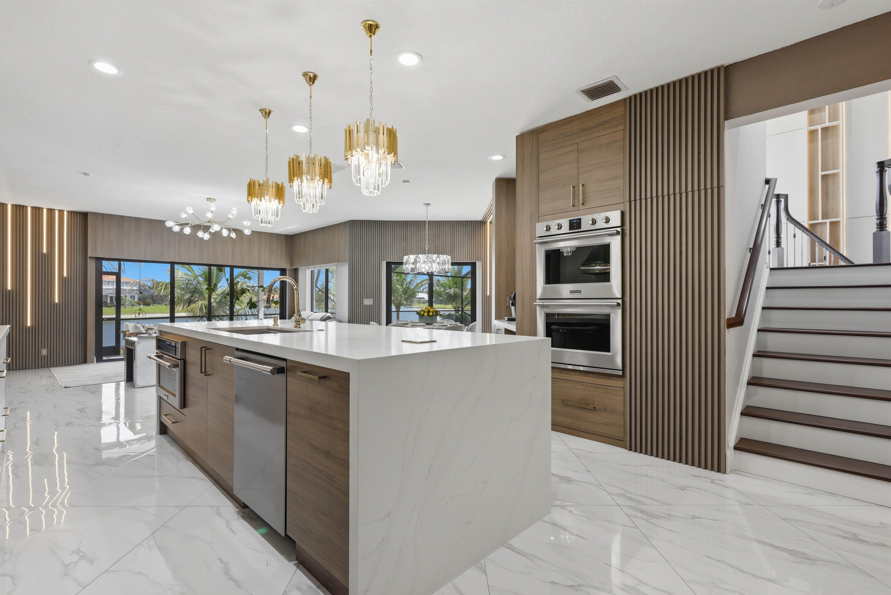 22257 Vista Lago Drive Boca Raton, FL 33428 - Photo 25 of 82 a kitchen with stainless steel appliances granite countertop a sink and a refrigerator