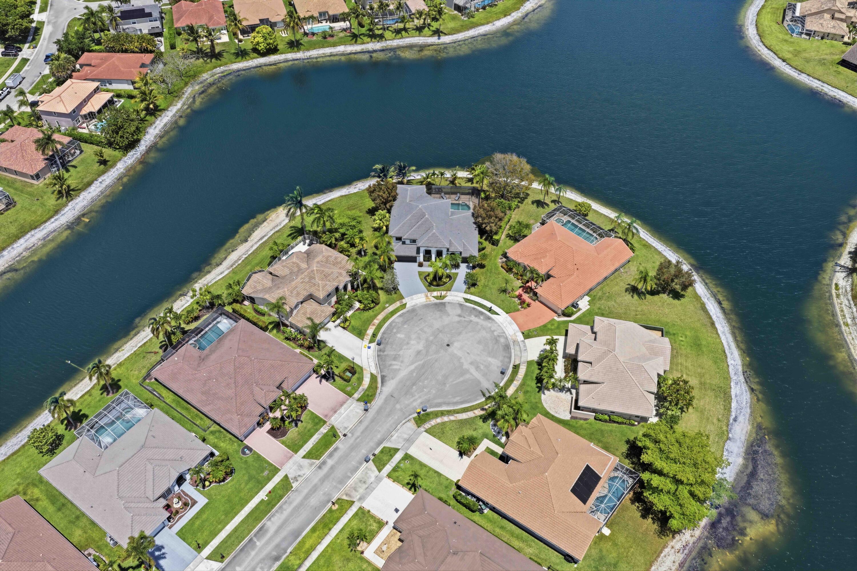 22257 Vista Lago Drive Boca Raton, FL 33428 - Photo 4 of 82 an aerial view of a house a yard and lake view