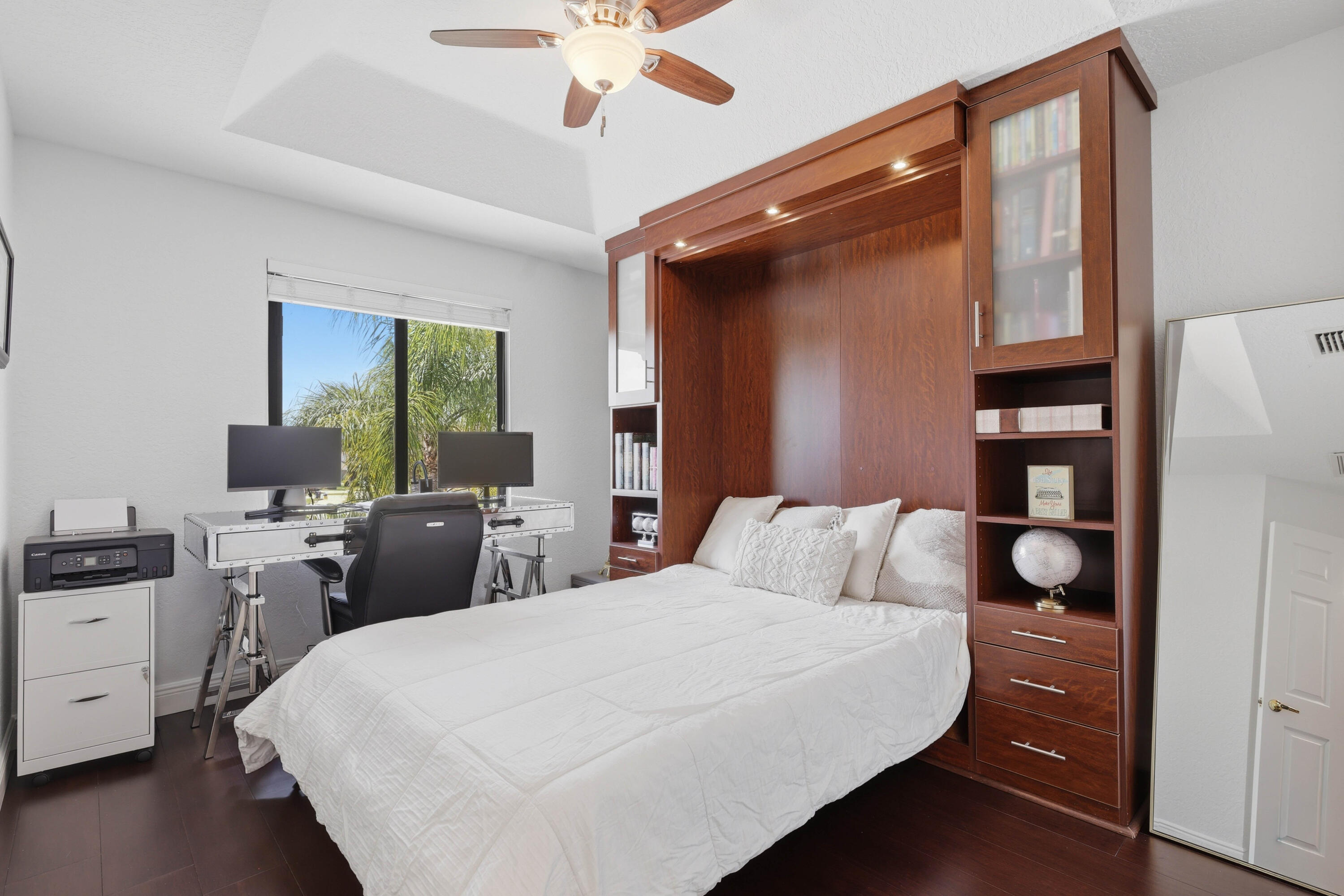 22257 Vista Lago Drive Boca Raton, FL 33428 - Photo 41 of 82 a bedroom with a bed and a flat tv screen on dresser