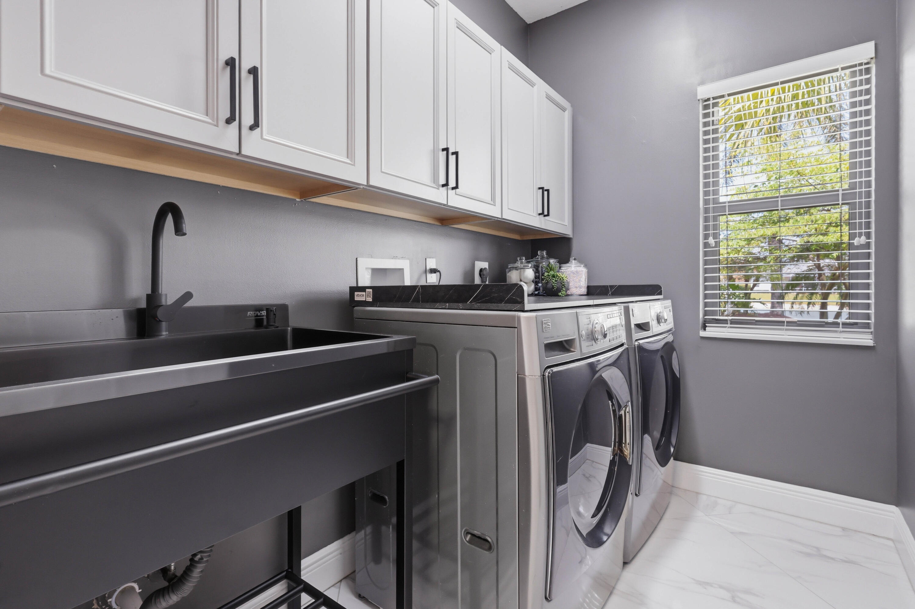 22257 Vista Lago Drive Boca Raton, FL 33428 - Photo 45 of 82 a utility room with dryer and washer