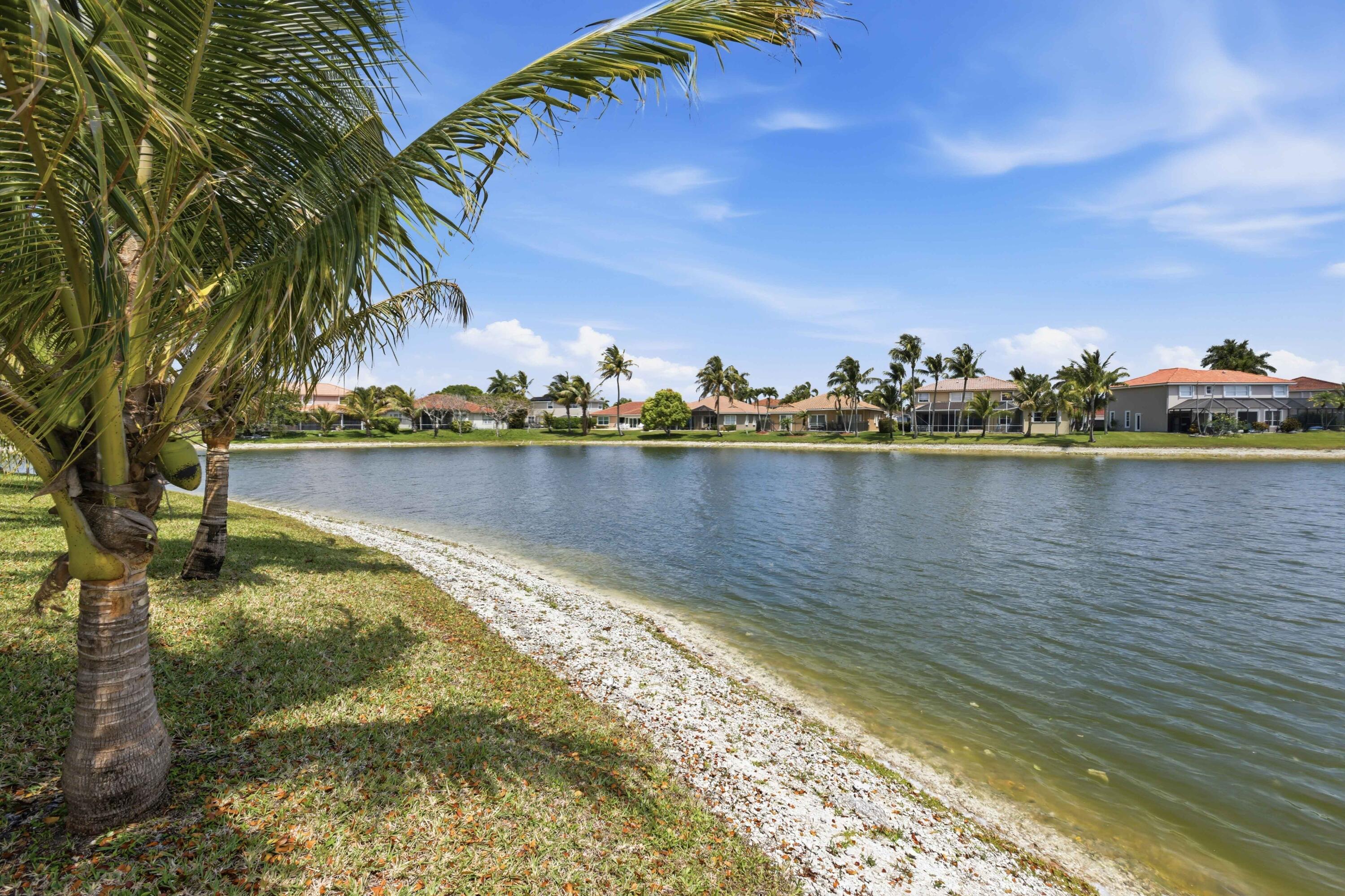 22257 Vista Lago Drive Boca Raton, FL 33428 - Photo 56 of 82 a view of a lake with houses in the back