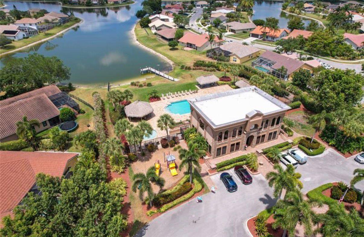 22257 Vista Lago Drive Boca Raton, FL 33428 - Photo 66 of 82 an aerial view of a house with a swimming pool and outdoor seating