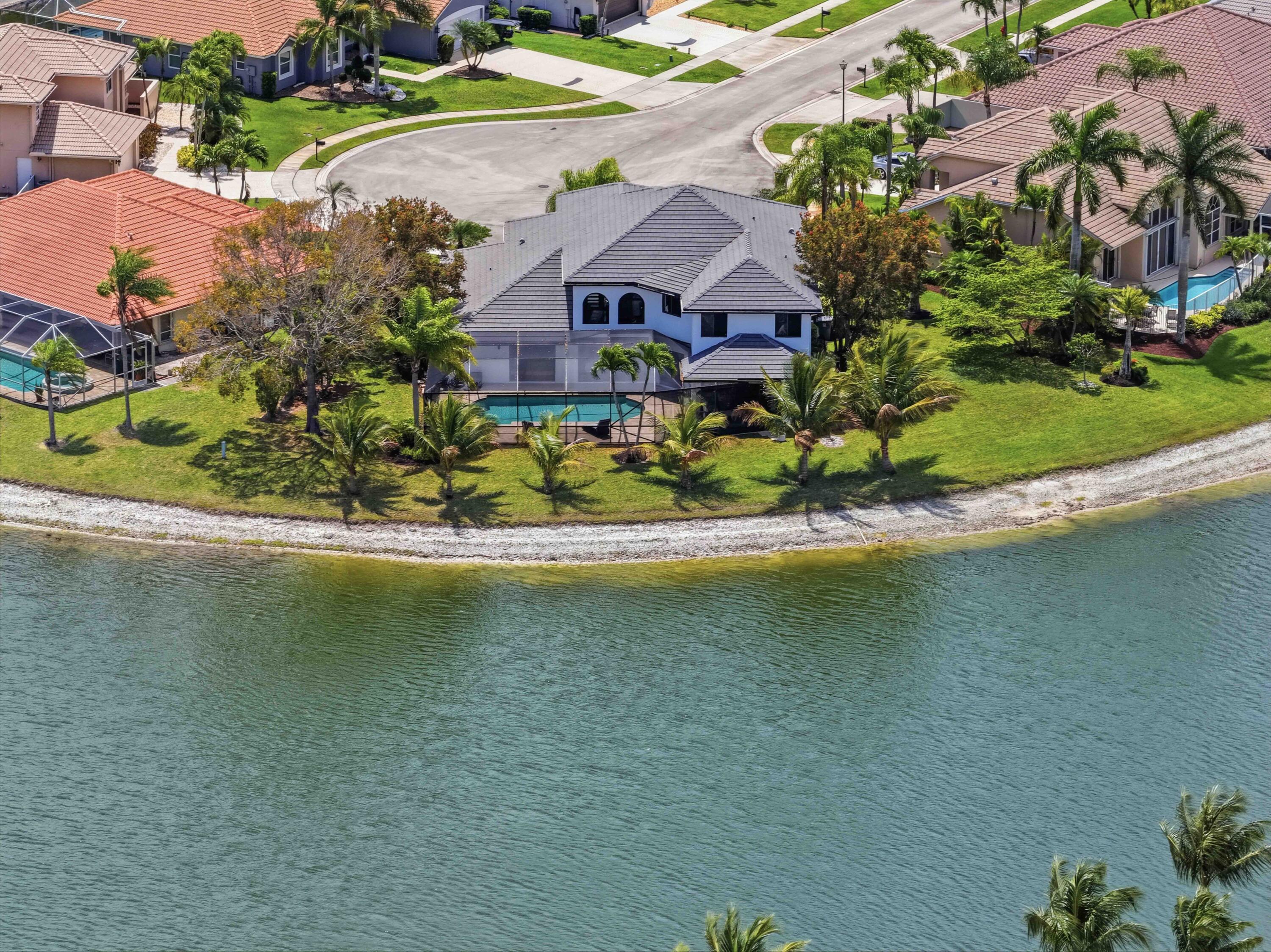 22257 Vista Lago Drive Boca Raton, FL 33428 - Photo 8 of 82 an aerial view of residential houses with outdoor space and lake view