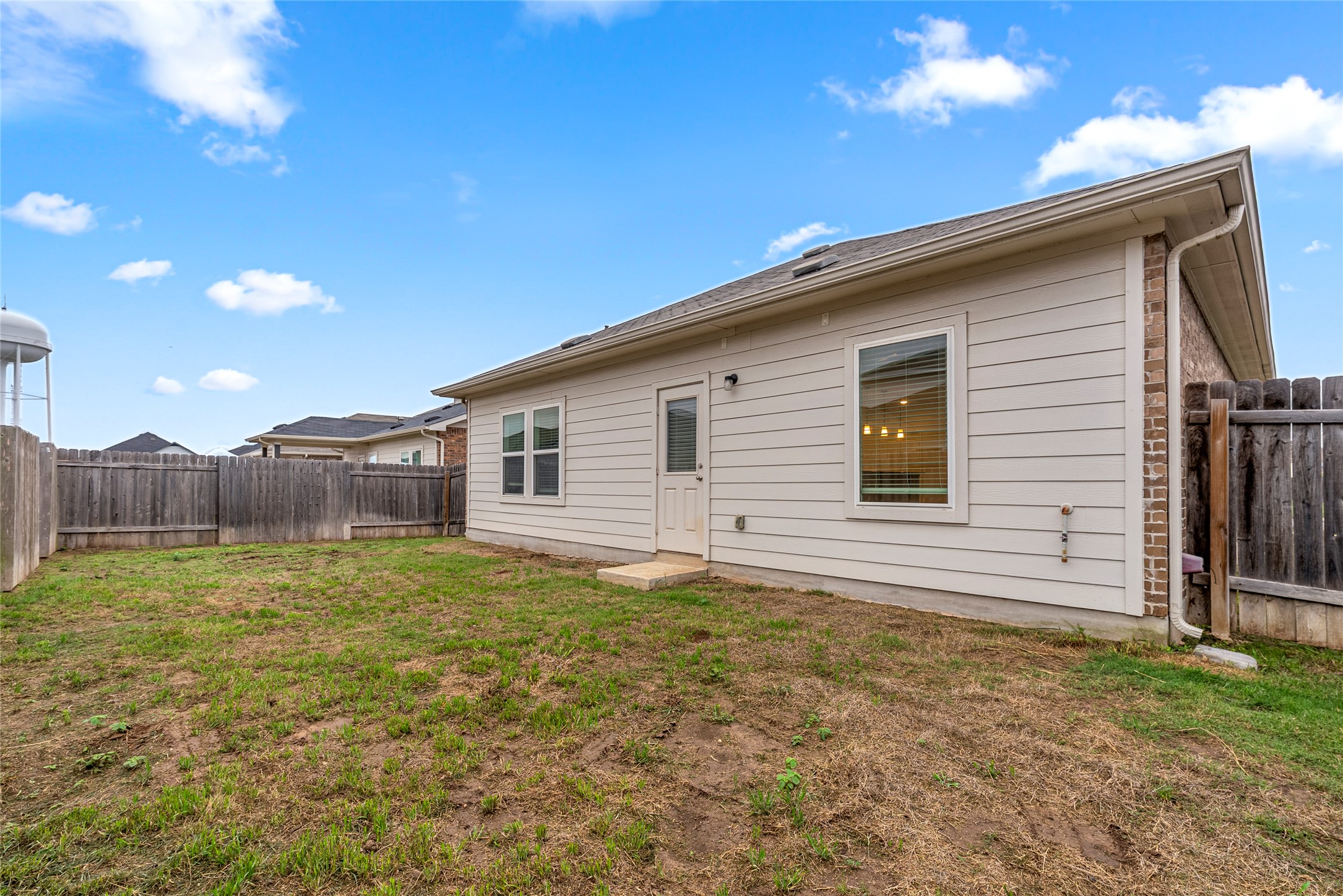 149 Biscayne Drive Kyle, TX 78640 - Photo 20 of 20 a view of a backyard of the house