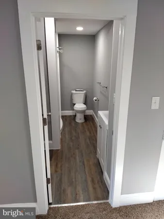 a view of a bathroom from the hallway