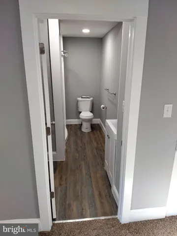 a view of a bathroom from the hallway